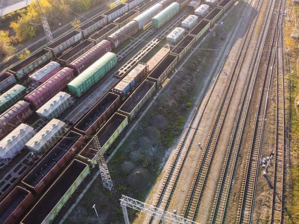 istock Freight train cars on railway siding 1353465757