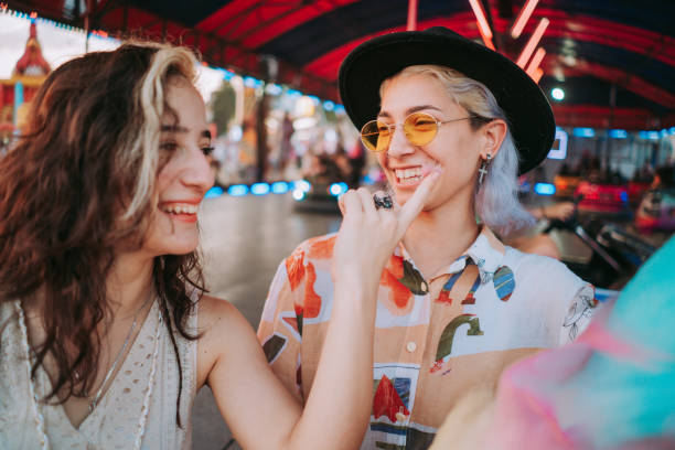 istock Friends in the amusement park 1353467360