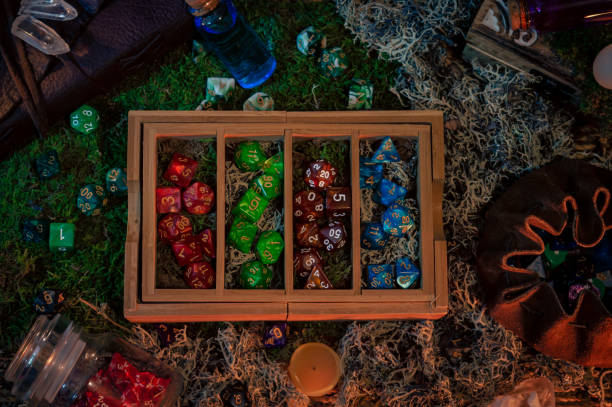 istock wooden dice tray with compartments filled with sets of RPG dice 1353467720