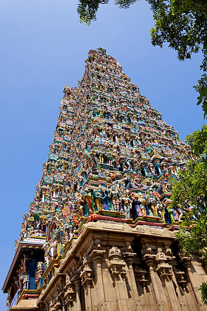 Madurai, India - Meenakshi Amman Temple The West Gopuram or Entrance Tower, to the Meenakshi Amman Hindu Temple in the 2500 year old South Indian city of Madurai.  The temple has 14 Gopurams in all but the main ones are located at the North, South, East and West entrances. menakshi stock pictures, royalty-free photos & images