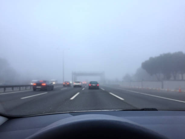 istock Driving in traffic on a foogy day 1353470841