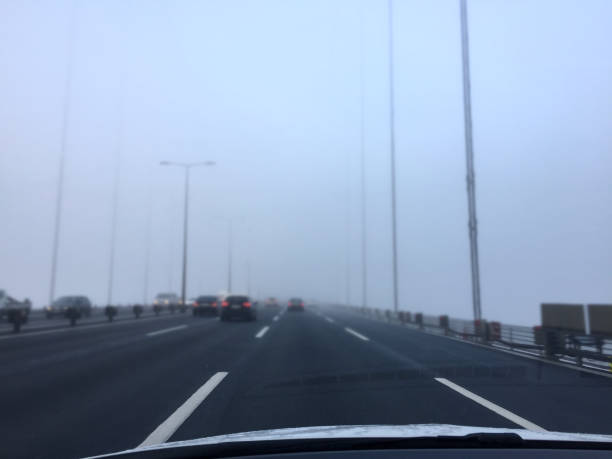 istock Driving in traffic on a foogy day 1353470995