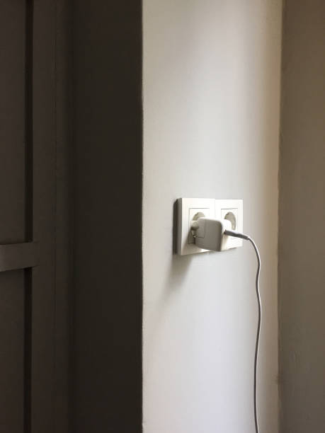 istock Charger in the electric plug 1353471613