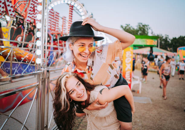 istock Friends having fun at fair 1353471750