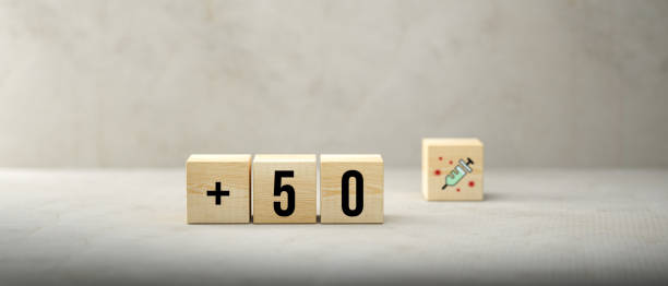 istock cubes with message +50 and syringe symbol - 3d illustration 1353471847