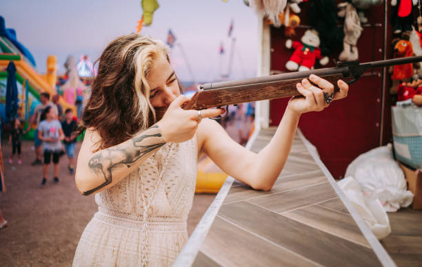 Smiling women in target shooting tent