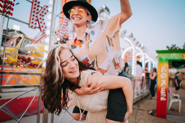 friends having fun at fair - funny scene imagens e fotografias de stock