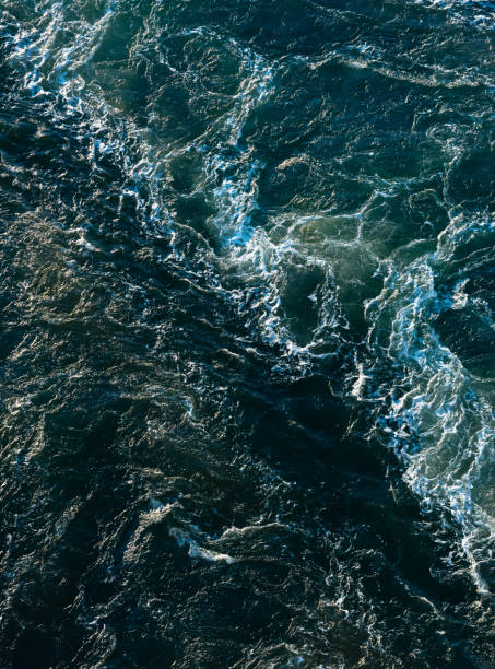 istock Wake of a ferry in blue and white.. 1353474318