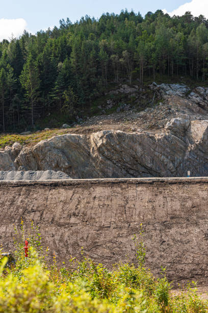 istock Cliffside being carved out creating a highway.. 1353474340