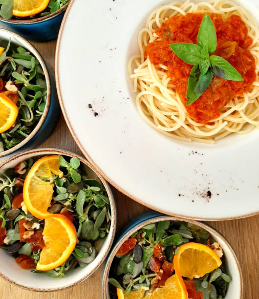 istock Spaghetti with Bolognese sauce and salad 1353474512