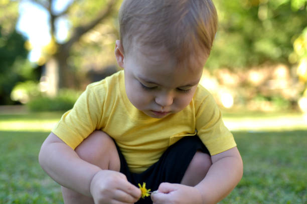 istock child playing outdoors 1353474698