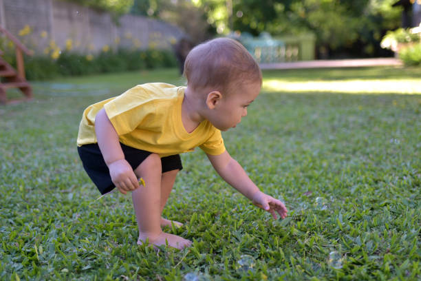 istock child playing outdoors 1353474840