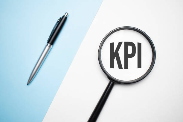 istock Finance and economics concept. Magnifier on a white background, inside the text is written - kpi 1353476668