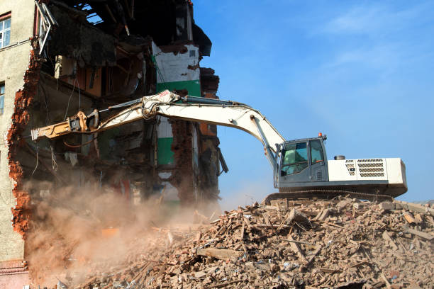 istock Blurred image Building demolition with hydraulic excavator. excavator loader machine at demolition construction site 1353476685