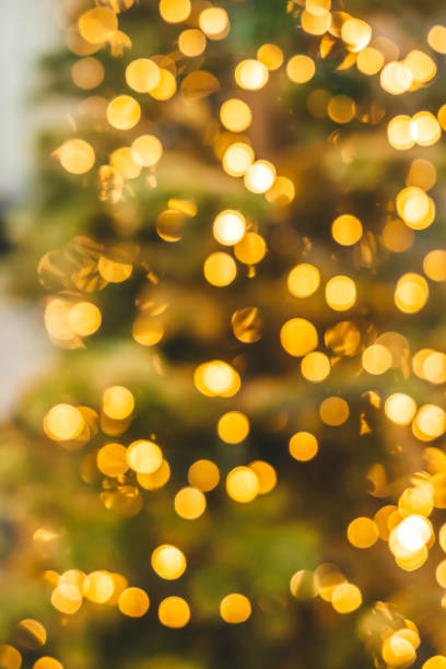 istock Abstract background with golden glitter bokeh lights 1353478277