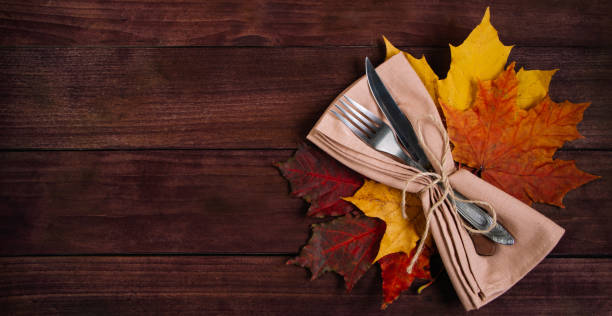 istock Happy Thanksgiving Day. Cutlery setting for festive dinner. Banner format. 1353480144
