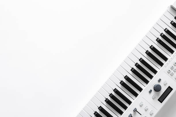 istock Musical background with musical keys on white, flat lay, copy space. 1353482290