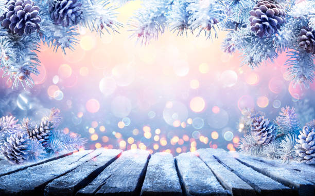 istock Winter Christmas Table With Fir Branches With Snow And Abstract Defocused Lights 1353482522