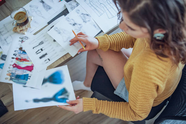 istock A creative young blogger who works in a creative office in her home 1353482581