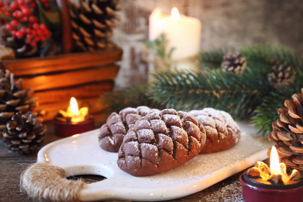 Christmas chocolate pine cone shortbread cookie, powdered sugar dressing, New Year's decoration. Rustic style
