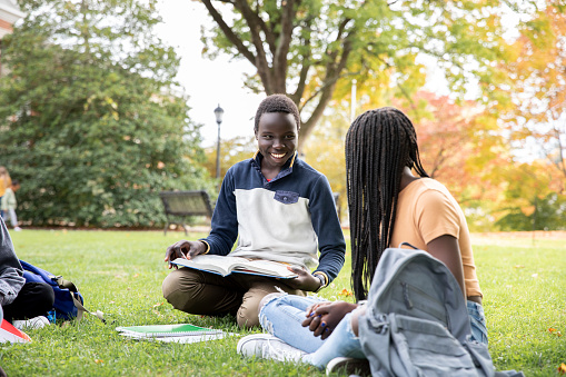 Friends Studying Together in Schoolyard