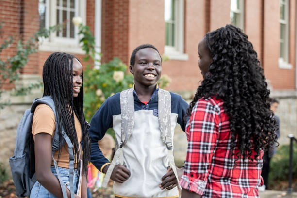 istock Mother saying goodbye to kids at School 1353484064