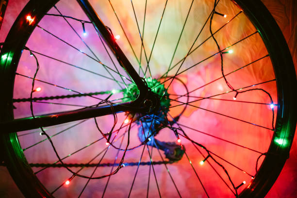 istock Bicycle wheel decorated with Christmas lights 1353484127