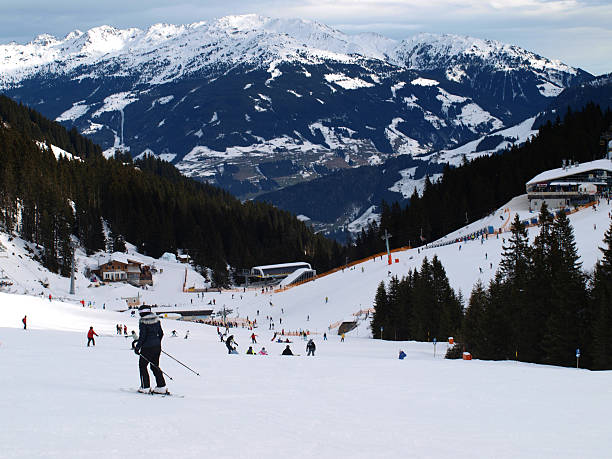 istock Mountain Range including Skiers and Fir Trees 135348445