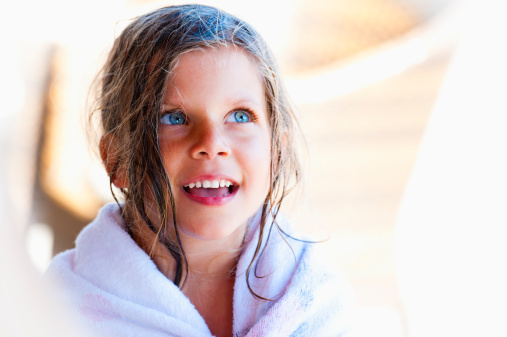Beautiful little girl with wet hair. Selective focus.