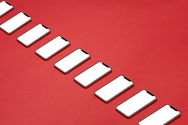 Smart phones in a row on red background
