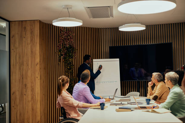 istock Executive team listening to contrary views from colleague 1353488371