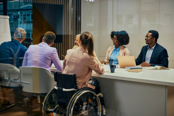 istock Group of executives having a boardroom meeting together 1353489015