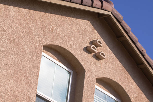 Mocha brown stucco home exterior.  Typical Southern California architectural style.