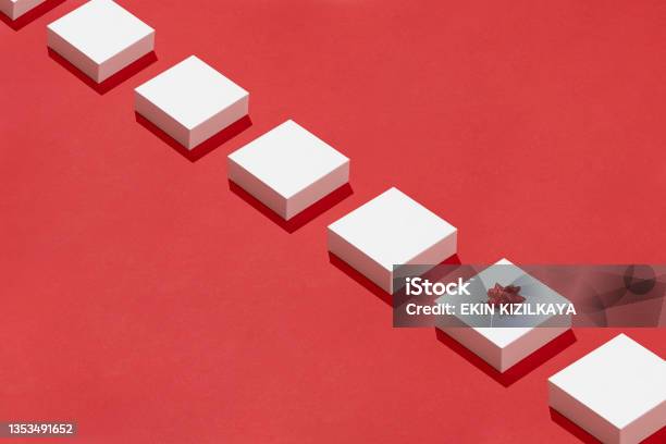 White Gift Boxes In A Row On Red Background Stock Photo - Download Image Now - In A Row, White Color, Knolling - Concept