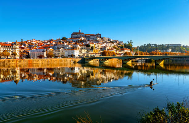 Coimbra and Mondego river View of Coimbra from leftside of Mondego River coimbra city stock pictures, royalty-free photos & images