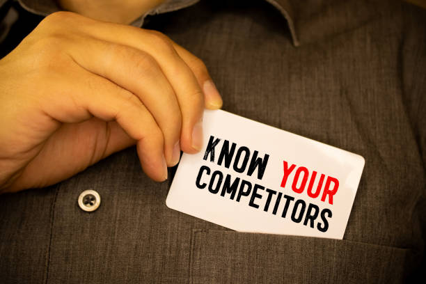 istock Businessman putting a card with text know your competitors in the pocket 1353502798