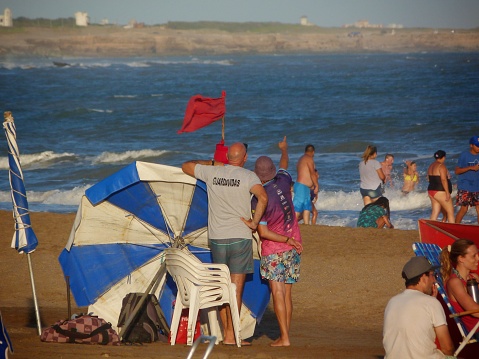 Buenos Aires, Argentina. January 24, 2021: two lifeguards watch the sea to look up for troubles