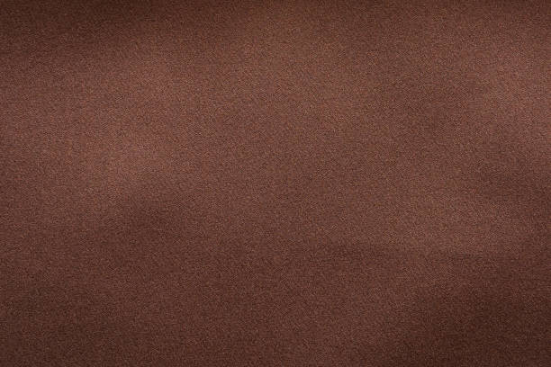 istock brown fabric texture background closeup 1353503760