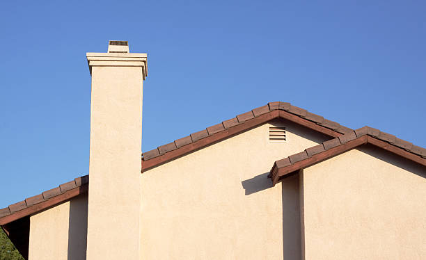 istock Stucco Home Glowing in Early Morning Sunlight and Blue Sky 135350598