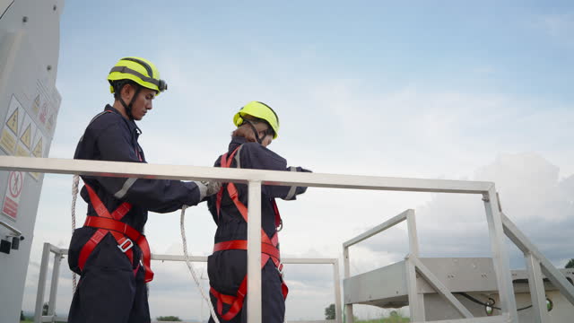 Asian technician Examining safety equipment