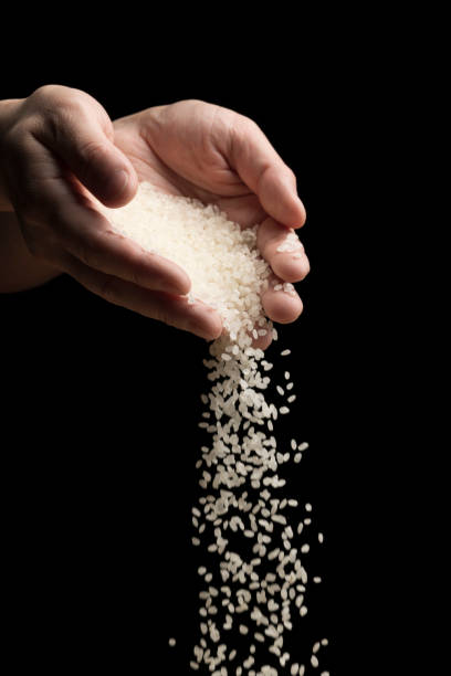 istock A man is holding rice in his hand. 1353517573