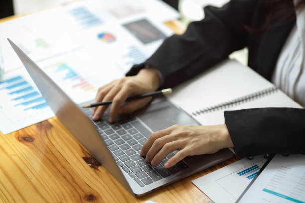 istock Female financial consultant working with laptop computer 1353526599