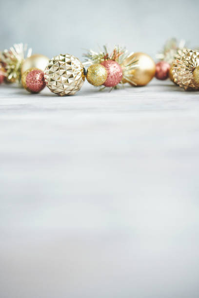 Modern Lux Christmas Backgrounds with Metallic Christmas Decorations on White Wood
