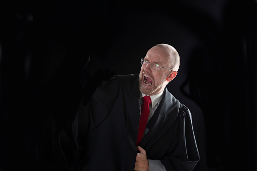 A middle age business man with black background with copy space
