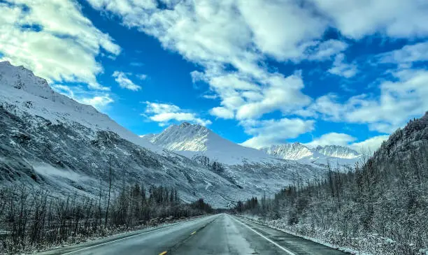 The Richardson Highway through the Chugach Mountain range in Valdez Alaska offers travelers fantastic views of the snow capped mountain ranges.