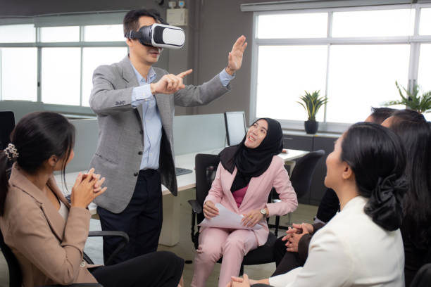 Young businessman is developer design testing of connection metaverse on vr realistic in the office, development global of engineer for creative application with collaboration, business concept. stock photo