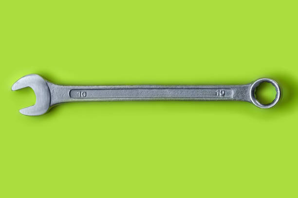 Steel tool close-up. Wrench on a green background.