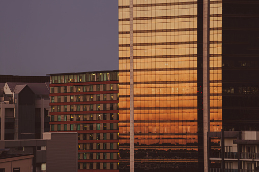 Office and apartment buildings at sunset