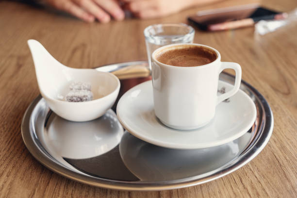 istock Traditional Turkish coffee with cold water and Turkish delight in cafe. Selective focus 1353544051