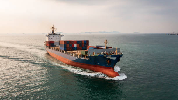 istock Container ship in import export global business worldwide logistic and transportation, Container ship unloading freight shipment, Aerial view container cargo boat freight ship. 1353544730